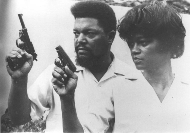 Robert and Mabel Williams with pistols, training in Cuba.